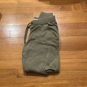 Hollister army green sweatpants with holes in the knees